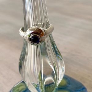 Round Sterling Silver Ring with Amethyst Stone.